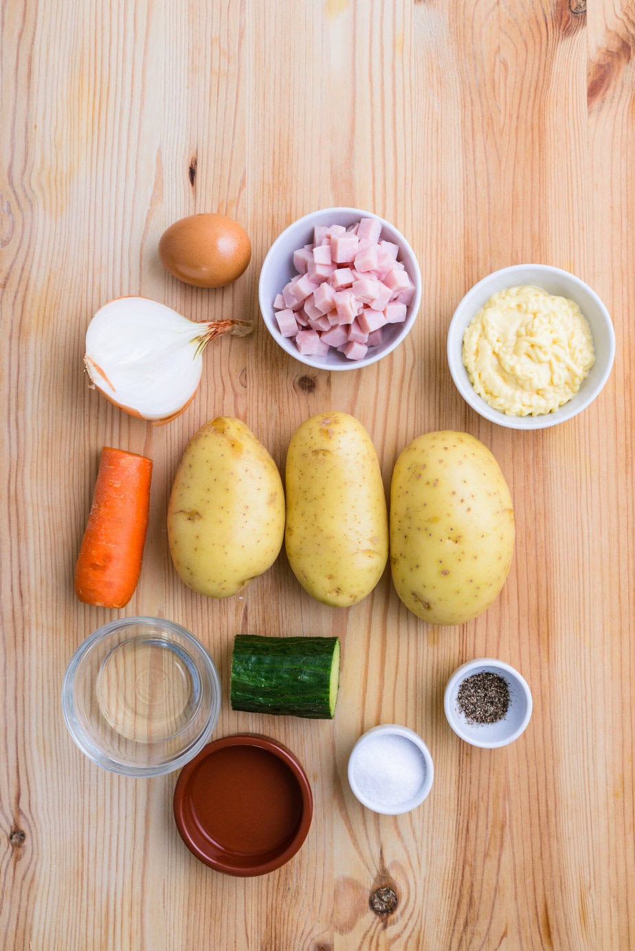 ingredients for Japanese Potato Salad on a Wooden Base