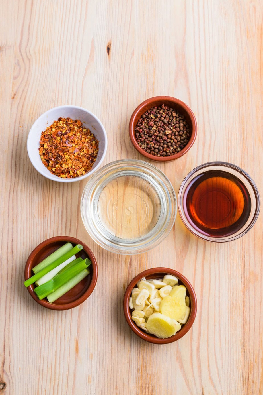 Ingredients for Japanese chili oil on a wooden background
