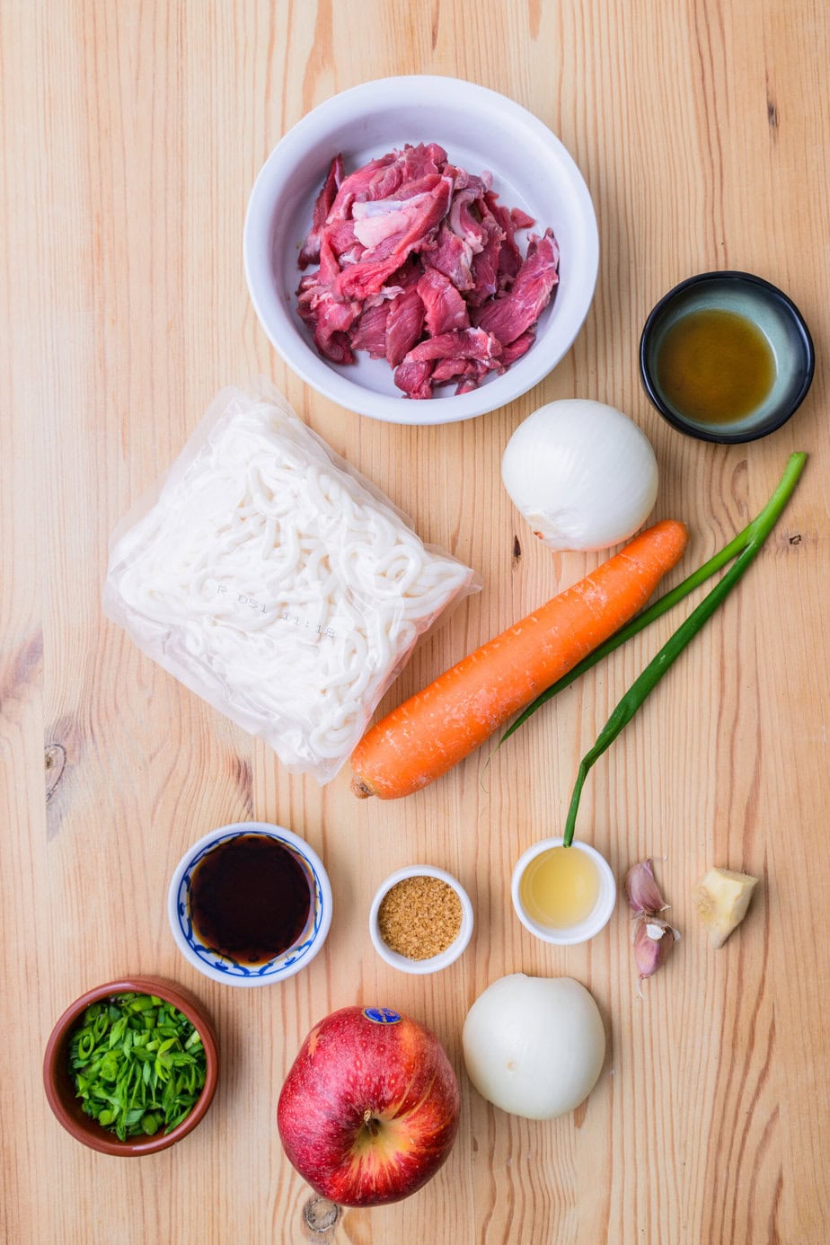 ingredients for Bulgogi udon on a wooden background