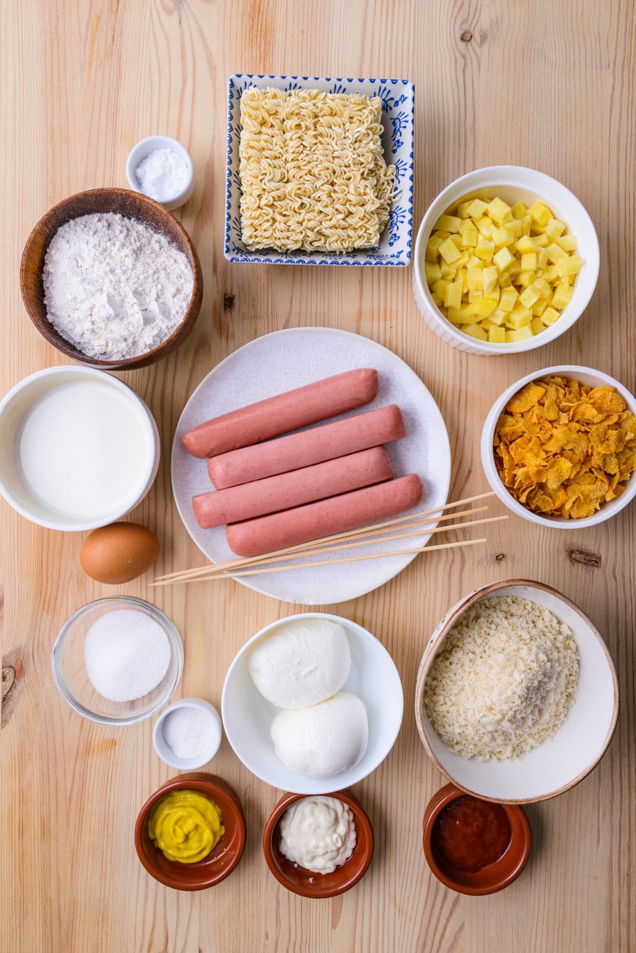 ingredients for Korean corn dogs on a wooden background