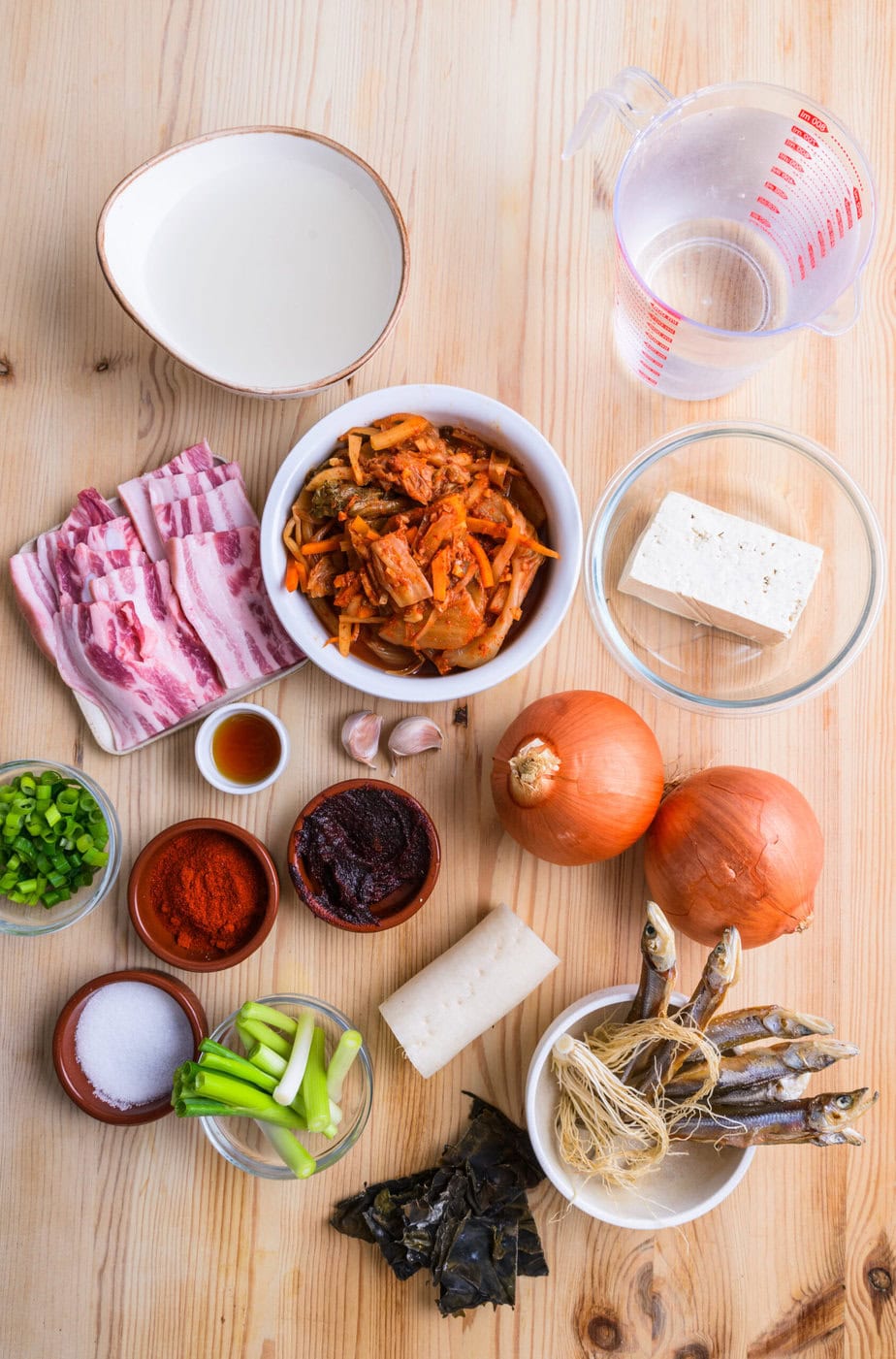 ingredients for Kimchi jigae on a wooden background