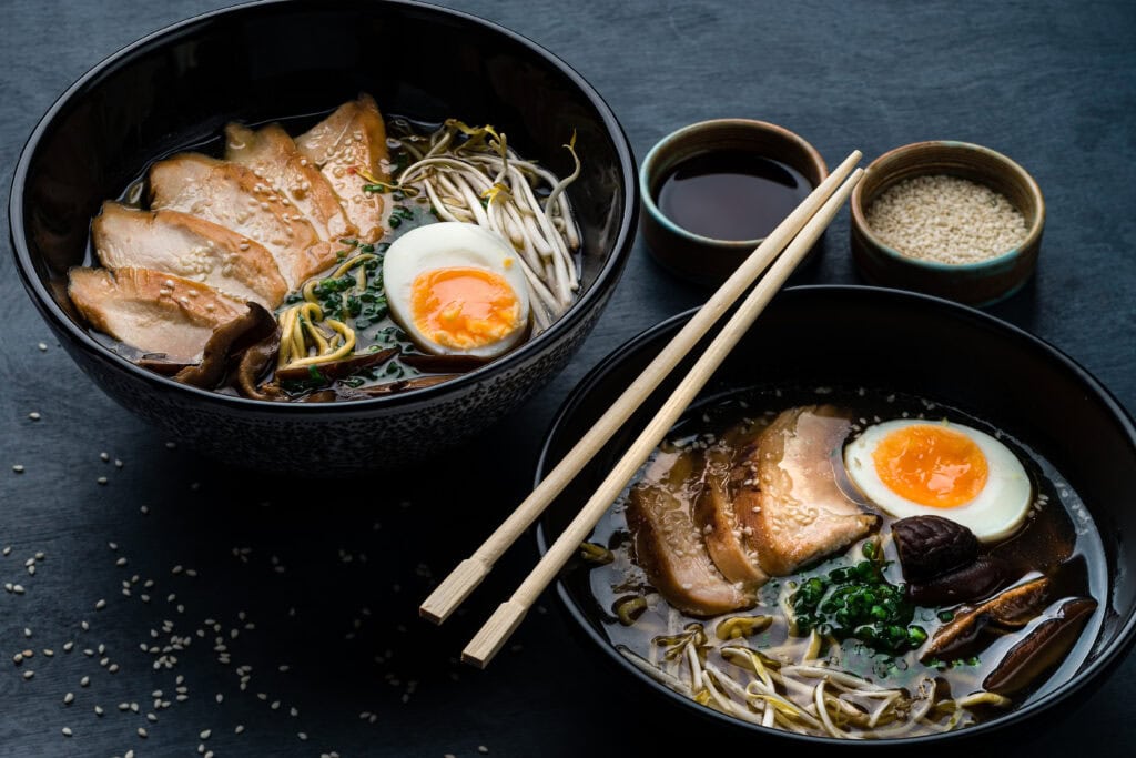 A well-filled bowl of Japanese ramen with a soft egg and grilled pork