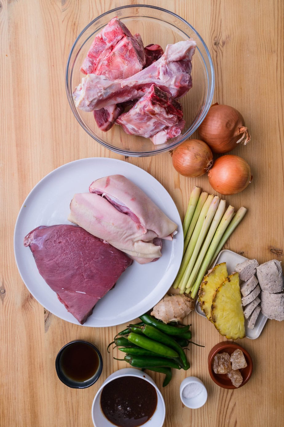 ingredients for bun bo hue on wooden background