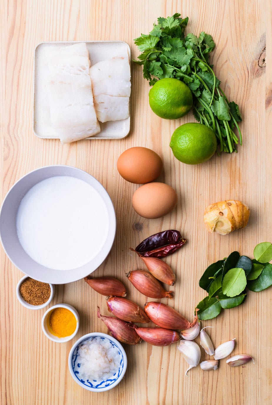 ingredients for fish amok on wooden background