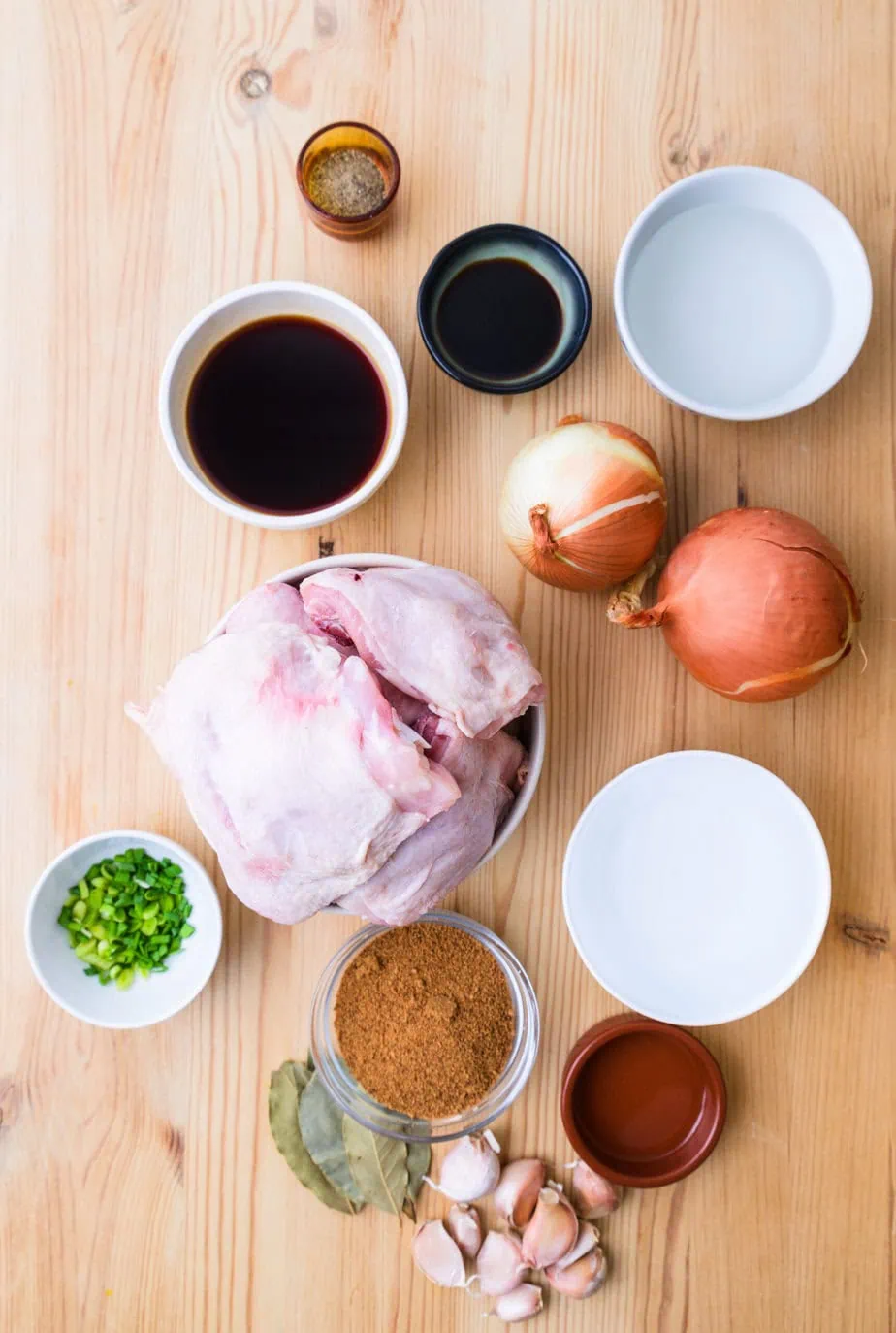 ingredients for chicken adobo on a wooden background