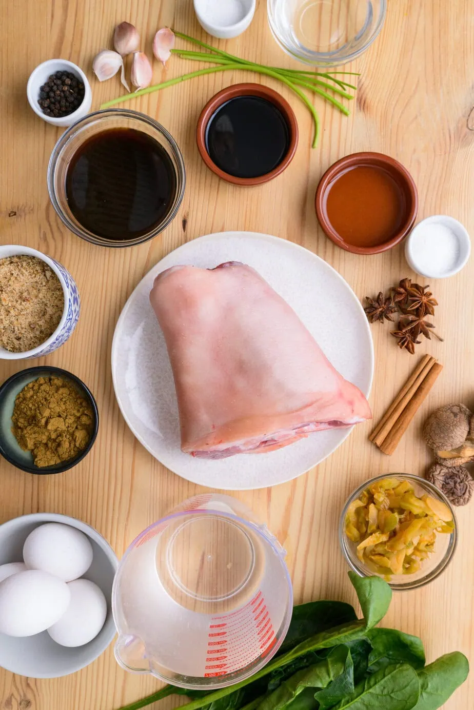 Ingredients for Khao kha moo on a wooden background