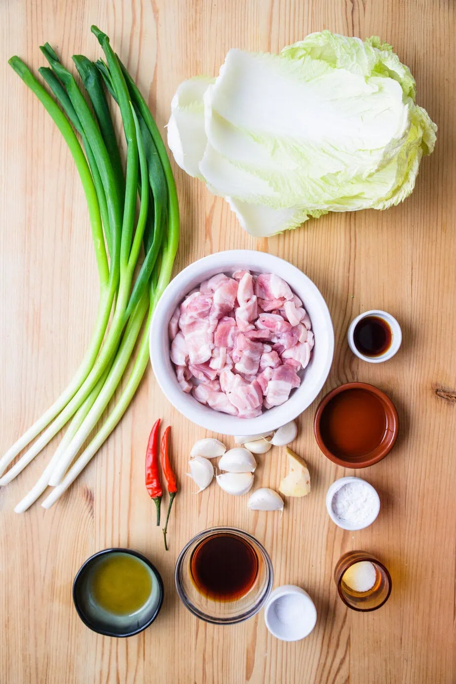 Ingredients for Pork Stir-Fry on a wooden background