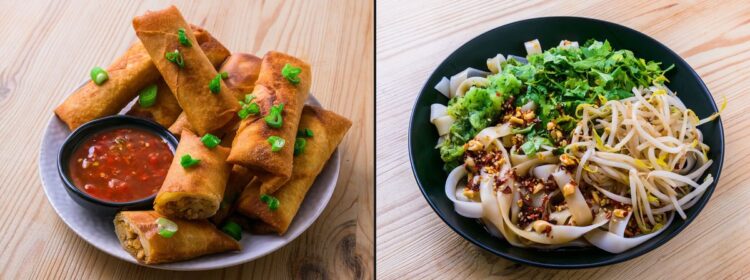 Assortiment de nems avec sauce et bol de nouilles de riz, légumes et cacahuètes sur une table en bois.