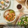 Couverture de livre de recettes “Sapori d’Asia in Primavera” avec plats asiatiques colorés.